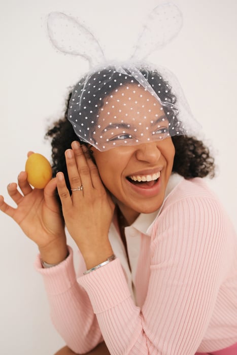 Stylish Woman Holding Easter Egg